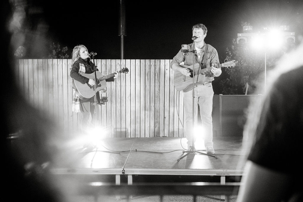 Image of Darcy Dawn and Tommy Filkoski performing at the 2025 Downtown Tree Lighting