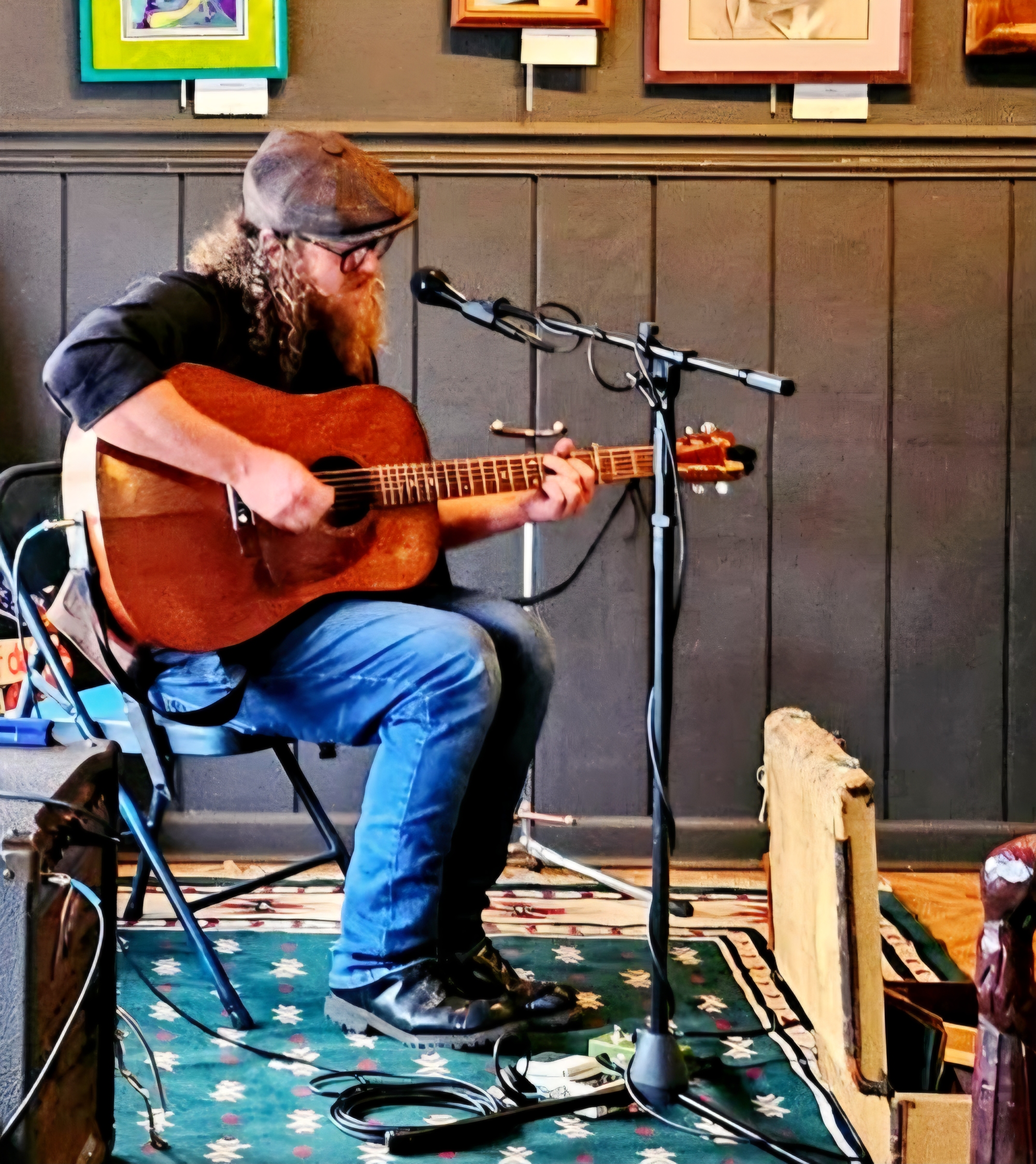 Image of Alexinder Gunn playing a guitar. Image of Matt Tyrrell playing an acoustic guitar.